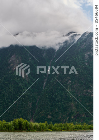 Fog in the mountain valley. Morning fog over the lake in the Altai mountains. Fog in the mountain valley. Morning fog over the lake in the Altai mountains. 85466694