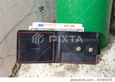 hand made leather wallet . Leather craft. Selective focus 85466979