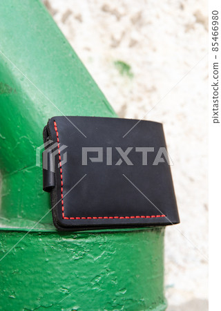 hand made leather wallet . Leather craft. Selective focus 85466980