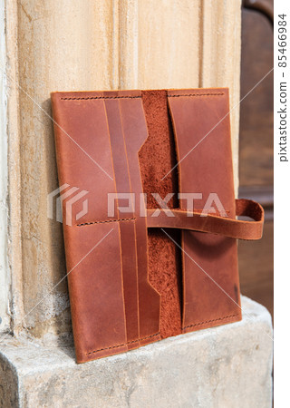 hand made leather wallet . Leather craft. Selective focus hand made leather wallet . Leather craft. Selective focus 85466984