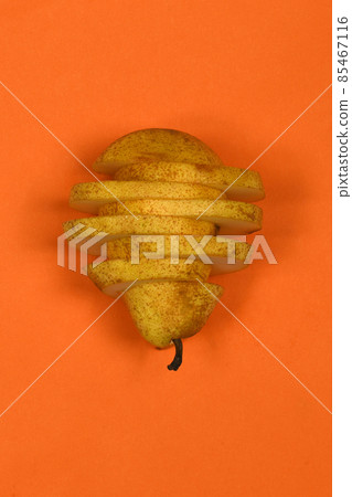 Pears isolated on orange background. Pears macro studio photo. Pears isolated on orange background. Pears macro studio photo. 85467116