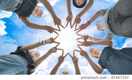 Girlfriends girls make circle shapes from their fingers and hands and then connect them. Girlfriends girls make circle shapes from their fingers and hands and then connect them. 85467297