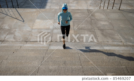 Fitness sports woman running up stairs in city Fitness sports woman running up stairs in city 85469207