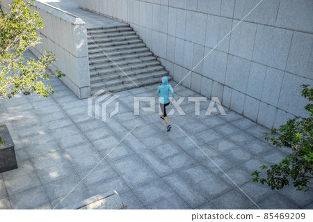 Fitness sports woman running up stairs in city Fitness sports woman running up stairs in city 85469209