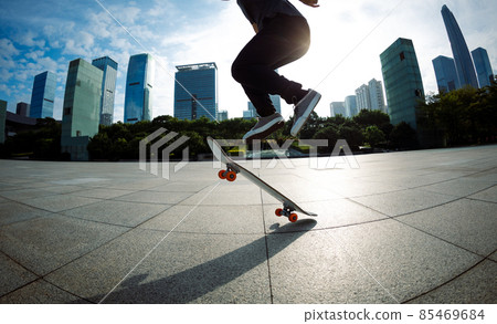 Skateboarder skateboarding outdoors in city 85469684
