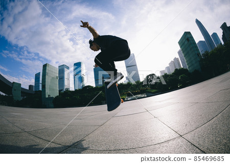 Skateboarder skateboarding outdoors in city 85469685