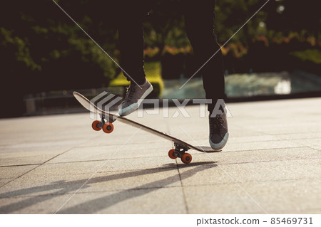 Skateboarder skateboarding outdoors in city Skateboarder skateboarding outdoors in city 85469731