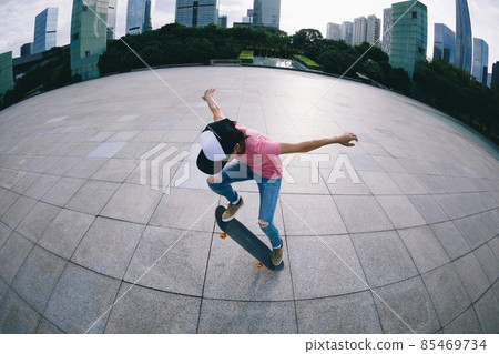 Skateboarder skateboarding outdoors in city Skateboarder skateboarding outdoors in city 85469734