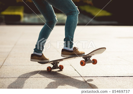 Skateboarder skateboarding outdoors in city Skateboarder skateboarding outdoors in city 85469737