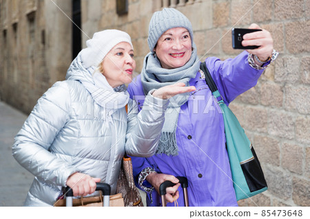 Senior females travelers taking selfie 85473648