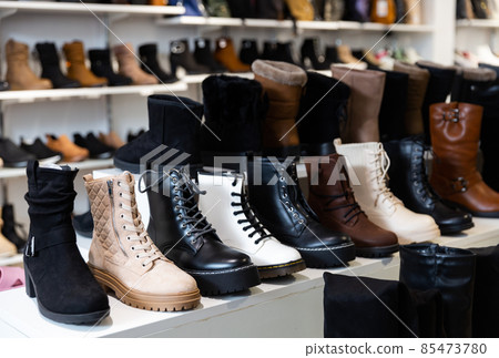 Lots of leather wintry male and female shoes at store 85473780