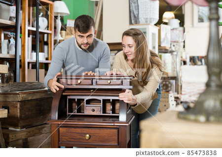 Couple satisfied with purchase of writing cabinet Couple satisfied with purchase of writing cabinet 85473838