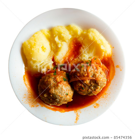 Fresh hot mashed potatoes and meatballs with gravy on plate. Russian cuisine 85474356
