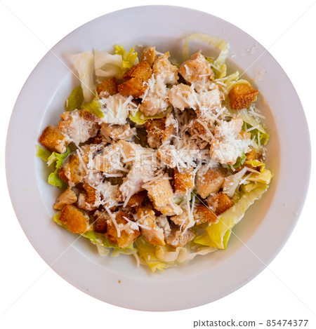 Cesar salad with chicken, lettuce and cheese parmesan 85474377
