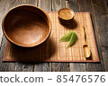 Empty wooden bowl on natural background. 85476576
