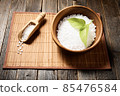 Wooden bowl with salt on natural background. 85476584