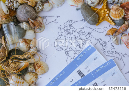 World map, seashells and pebbles boarding pass. Travel vacation concept. Summer sea holidays. Tourism and resorts. 85478236