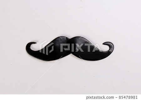 Black moustache shape paper die cut selfie portrait party fun paper prop sticker stick on white background  85478981