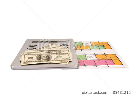 Hundred dollar bills money pile and and calculator on blueprints with an architecture model Hundred dollar bills money pile and and calculator on blueprints with an architecture model 85481213