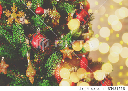 Christmas spirit concept. Pine tre with decorations on festive bokeh background. 85481518