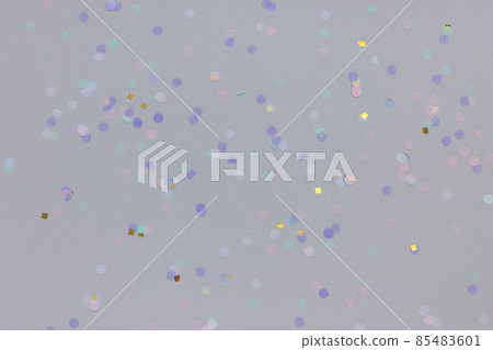 Multicolored confetti on gray background. Carnival and festive holiday concept 85483601