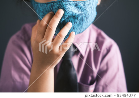 happy child girl in school green wearing a mask happy child girl in school green wearing a mask 85484377
