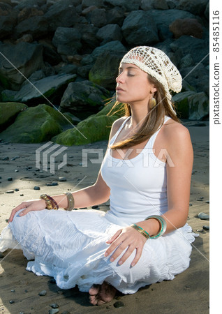 beautiful woman in the beach wearing white clothes near the sea beautiful woman in the beach wearing white clothes near the sea 85485116