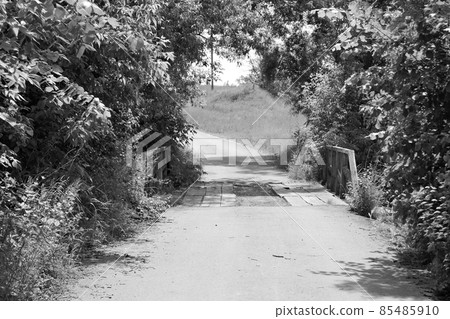 Beautifully standing old wooden bridge over river in colored background Beautifully standing old wooden bridge over river in colored background 85485910