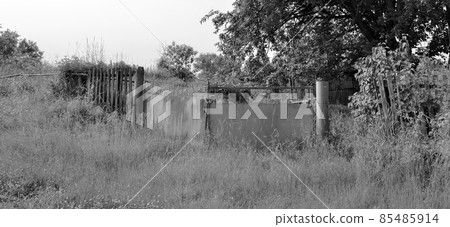 Beautiful old gate from abandoned house in village 85485914