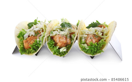 Yummy fish tacos in holder isolated on white Yummy fish tacos in holder isolated on white 85486615