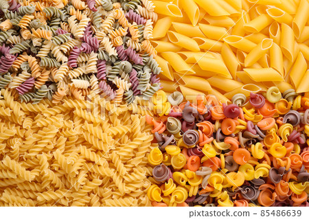Different types of pasta as background, top view 85486639
