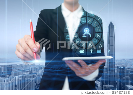 Woman In A Suit Virtually Writing On Screen Holding Tablet Showing Futuristic Technology. Businesswoman Wearing Uniform Handwriting Using Pad Presenting Modern Automation. Woman In A Suit Virtually Writing On Screen Holding Tablet Showing Futuristic Technology. Businesswoman Wearing Uniform Handwriting Using Pad Presenting Modern Automation. 85487128