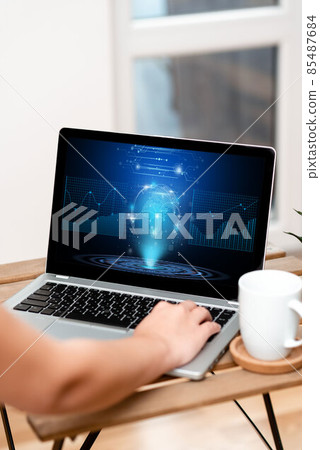 Hand Resting On Laptop Top Of Table Beside Coffee Mug Actively Accomplishing Work From Home. Arm Making New Tasks Next To Cup Finishing Remote Job Projects. Hand Resting On Laptop Top Of Table Beside Coffee Mug Actively Accomplishing Work From Home. Arm Making New Tasks Next To Cup Finishing Remote Job Projects. 85487684