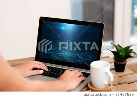 Hand Of Woman Typing On A Laptop Beside Coffee Mug And Beautiful Plant Accomplishing Work From Home. Girl S Arm Making New Projects Finishing Remote Jobs. 85487689