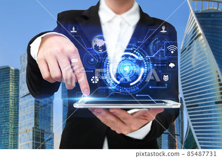 Woman In A Suit Pointing The Top Screen Of Tablet Showing Futuristic Technology. Businesswoman Wearing Uniform Spotting Into Pad Presenting Modern Automation. Woman In A Suit Pointing The Top Screen Of Tablet Showing Futuristic Technology. Businesswoman Wearing Uniform Spotting Into Pad Presenting Modern Automation. 85487731