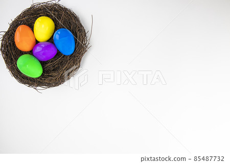 Colorful painted Easter Eggs isolated on white background with nest.Top view Happy Easter Holiday copy space Colorful painted Easter Eggs isolated on white background with nest.Top view Happy Easter Holiday copy space 85487732