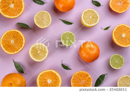 Flat lay composition with tangerines and different citrus fruits on lilac background Flat lay composition with tangerines and different citrus fruits on lilac background 85488651
