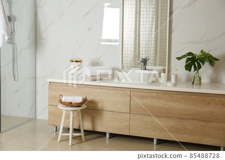 Large mirror and vessel sink in stylish bathroom 85488728