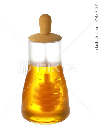 Jar with organic honey and dipper isolated on white 85489137