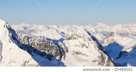 Aerial Panoramic View of Canadian Mountain covered in snow Aerial Panoramic View of Canadian Mountain covered in snow 85489561