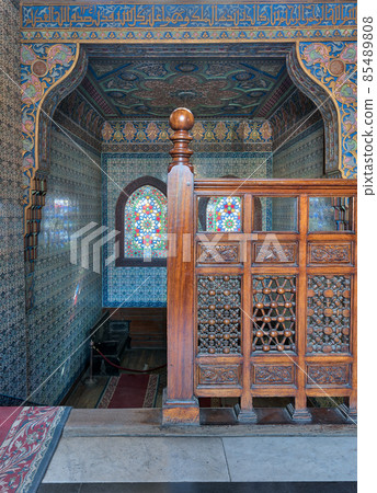 Wooden staircase, decorated wooden balustrade, Turkish ceramic tiles wall, ornate ceiling, stained glass windows, Residence hall at Manial Palace of Prince Mohammed Ali, Cairo, Egypt 85489808