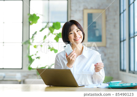 Final tax return image of a young housewife entering a receipt at home Final tax return image of a young housewife entering a receipt at home 85490123