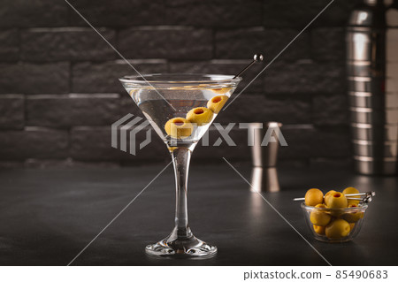 Martini cocktail on dark stone table. 85490683