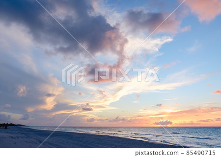 Beautiful colored cloudy evening sky.  Seascape. 85490715