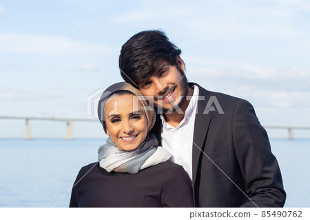 Portrait of loving Arabic couple during walk Portrait of loving Arabic couple during walk 85490762