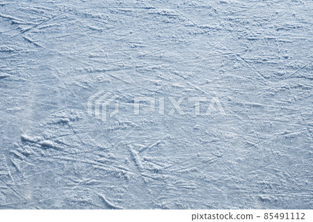Ice skating rink, cutting ice, snow. Winter sport. Scratches on the surface of the ice. Close-up photo. 85491112