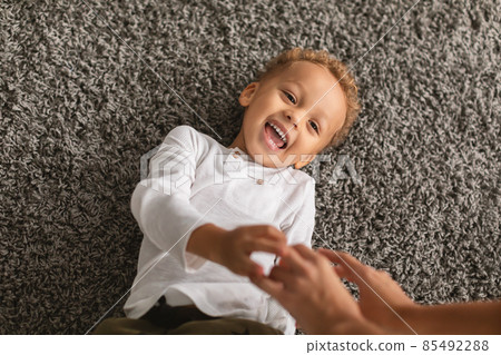 Black Little Boy Laughing Lying While Mommy Tickling Him Indoor 85492288