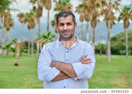 Outdoor portrait of mature confident man looking at camera Outdoor portrait of mature confident man looking at camera 85493293