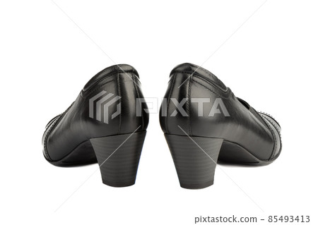 Side view of heels on women's shoes on a white background. Side view of heels on women's shoes on a white background. 85493413