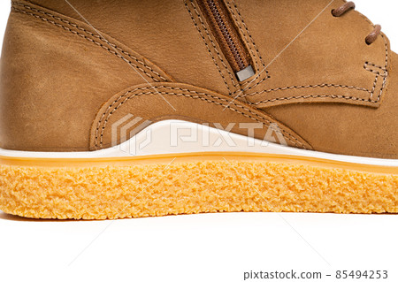 part of brown leather winter boots with lacing on a white background 85494253